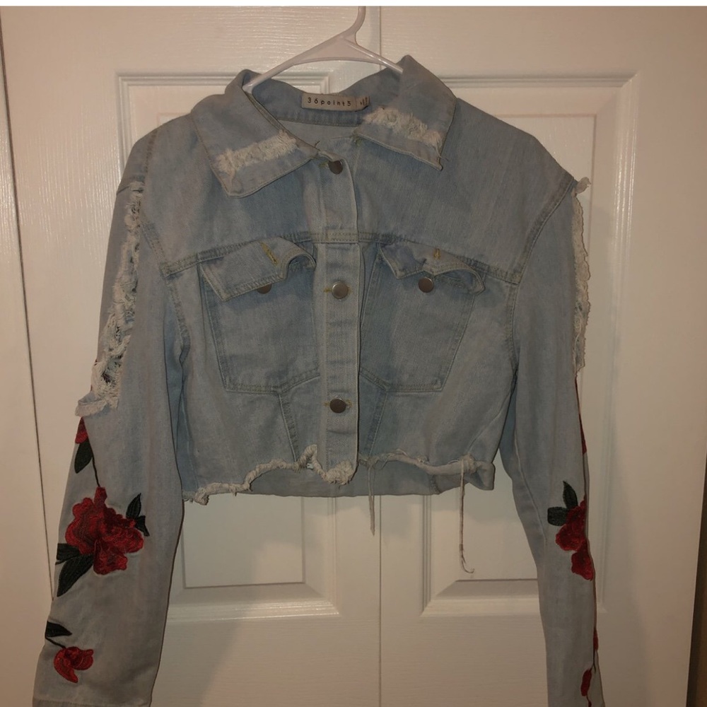 Distressed cropped jacketRose detailing on sleeves
